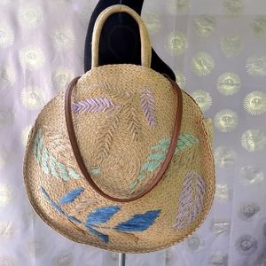 Artisanal woven circle straw tote